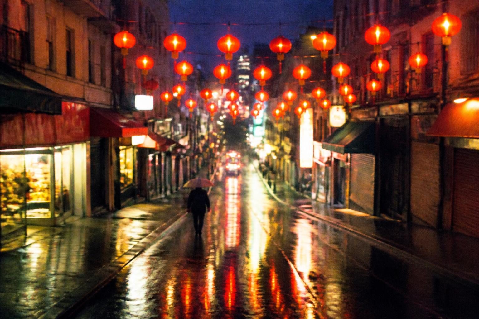 A rainy Chinatown street with red lanterns