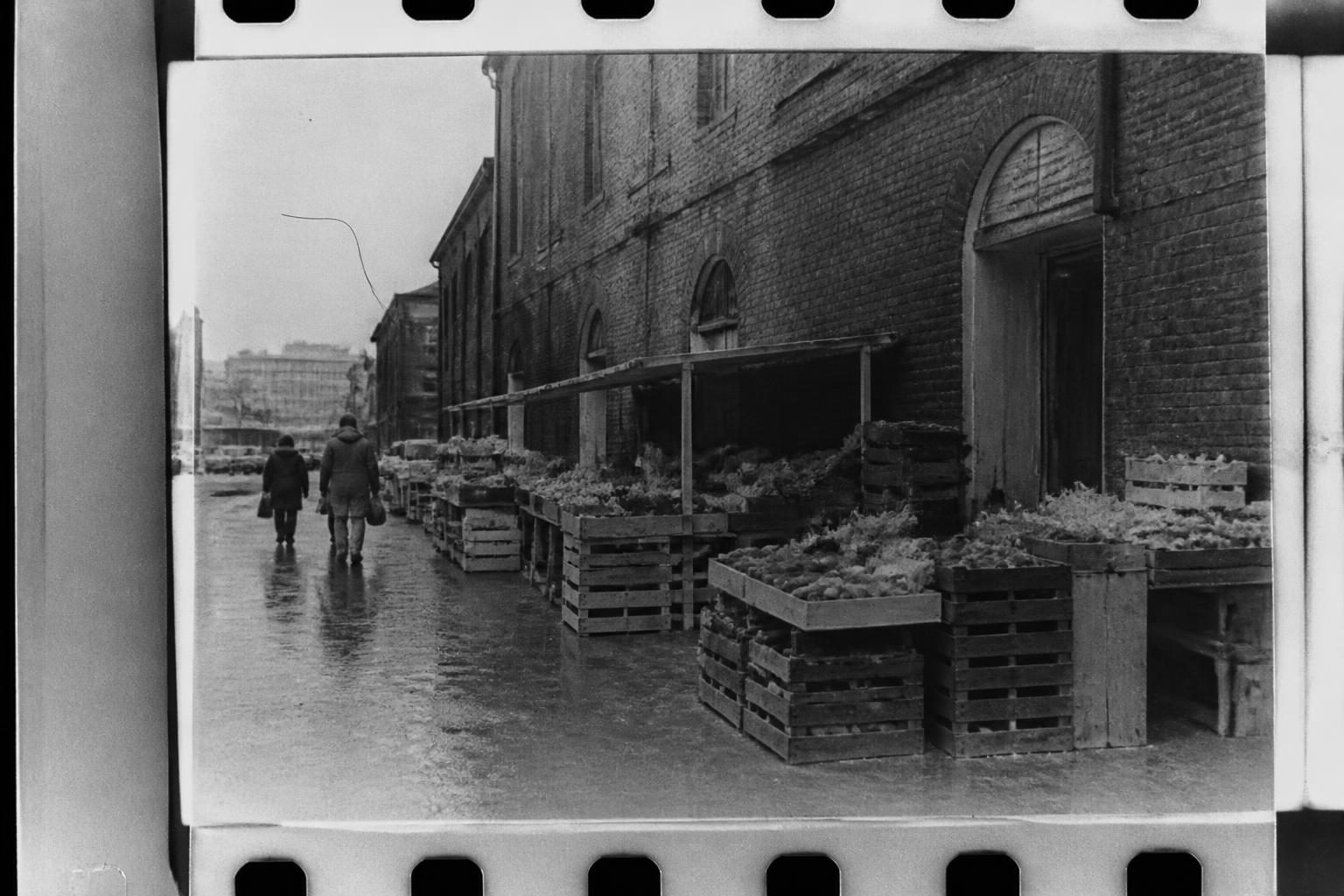 Black and white film scan of a market street