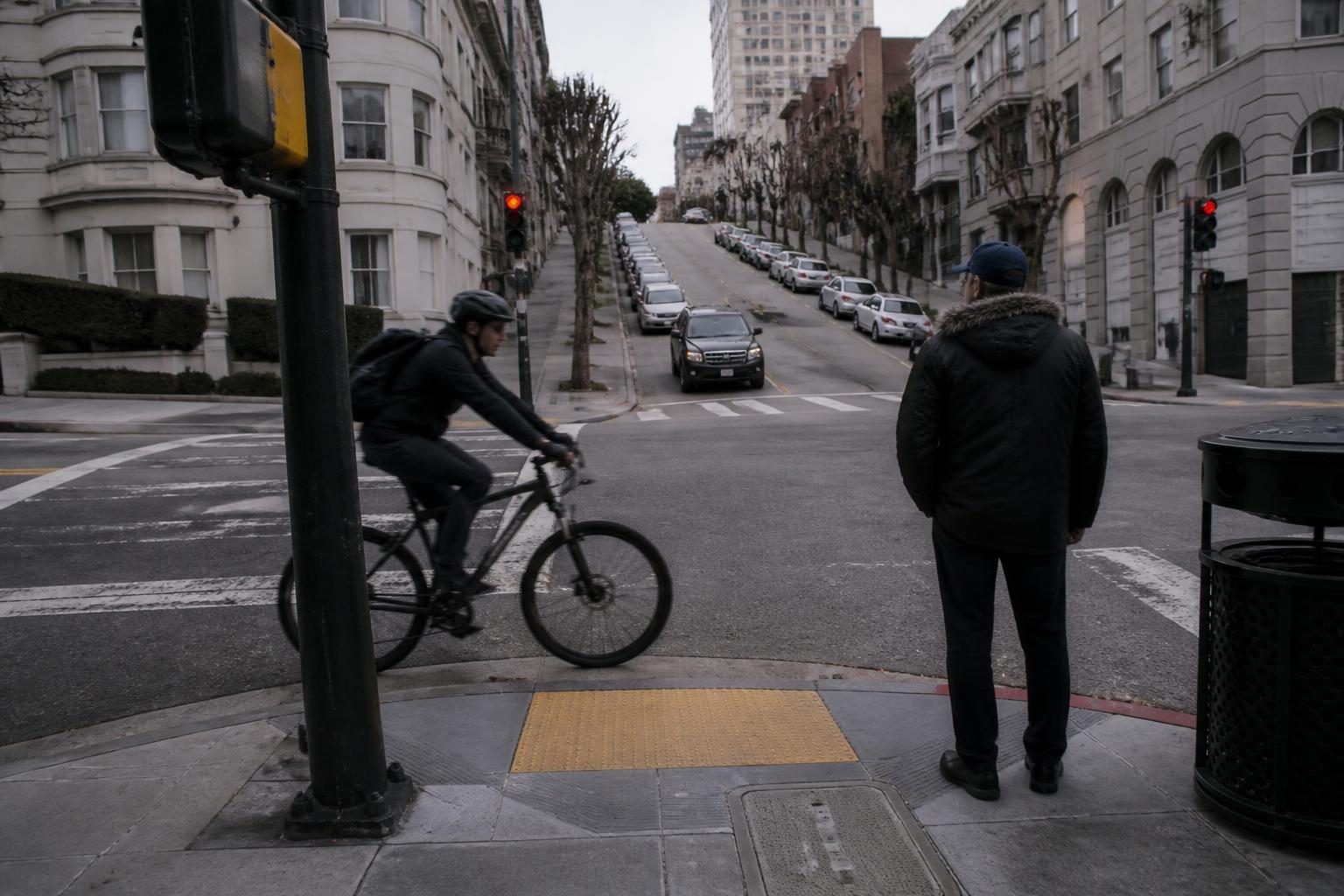 Street corner with a cyclist, snap focused at two metres